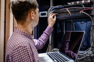 In the server room a technician