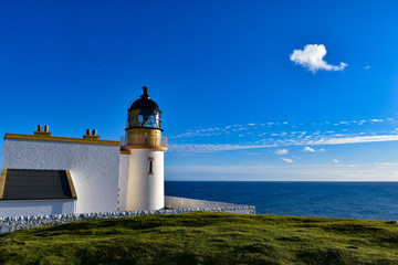 lighthouse on coast of sea