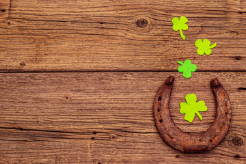 Cast iron metal horse horseshoes, felt clove leaf. Good luck symbol, St.Patrick's Day concept