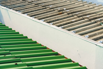 The roofs of the two houses that are near each other