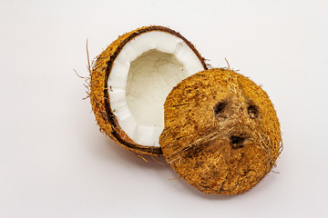 Ripe coconut cut on two half isolated on white background