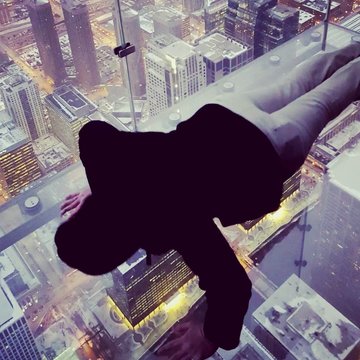 High Angle View Of Man Doing Push-ups On Glass At Skydeck Chicago