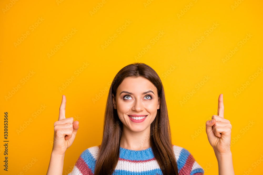 Sticker Close-up portrait of her she nice attractive pretty cute cheerful cheery confident girl pointing two forefingers up copy space ad advert isolated on bright vivid shine vibrant yellow color background