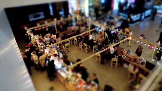 gift market in the mall, time-laps in the store from above, shopping movement