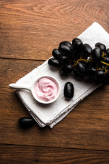 Black grapes, yogurt and honey mix face mask or cream for skin dark spot removal treatment, created using Angoor extract, curd and honey. selective focus