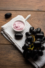 Black grapes, yogurt and honey mix face mask or cream for skin dark spot removal treatment, created using Angoor extract, curd and honey. selective focus