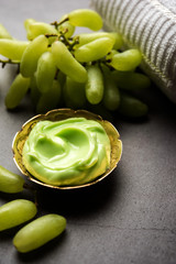 Green grapes, yogurt and honey mix face mask or cream for skin dark spot removal treatment, created using Angoor extract, curd and honey. selective focus