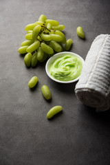 Green grapes, yogurt and honey mix face mask or cream for skin dark spot removal treatment, created using Angoor extract, curd and honey. selective focus