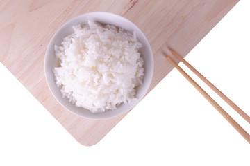 White rice on ceramic plate top view with bamboo chopstick