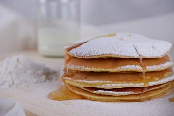 Hot pancake with sugar and honey toppings