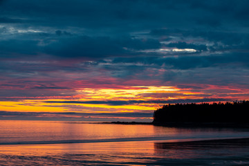 Setting sun over teh beach at NIssen Bight, Cape Scott Provincial Park, Vancouver Island, British Columbia, Canada