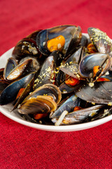 Mussel with white wine sauce on table