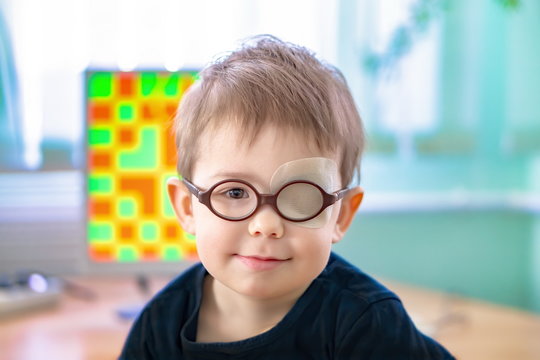 A little boy with an occluder undergoes a hardware vision treatment.