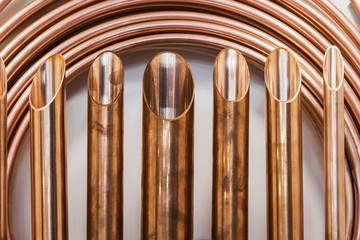 samples of copper tubes and rolled tubes. Focus in the middle of the frame