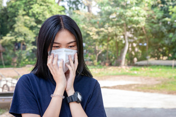 Asian women wearing medical protective masks to prevent virus infection. Corona virus or Covid-19, Healthcare concept