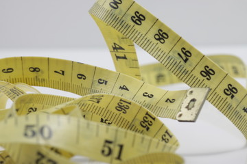 Close up shot of measurement tape isolated on white background