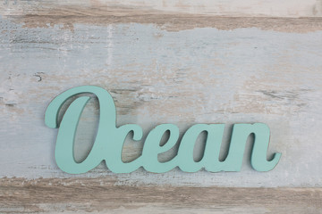 Word Ocean On Wooden Background