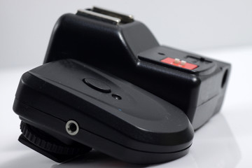 Close up shot of black camera flash trigger isolated on white background