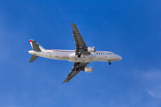 Beautiful airplane of Middle East Airlines model Airbus a320 ready to landing in Fiumicino International Airport in a Rome s sunny day,Fiumicino;Italy December 17; 2017