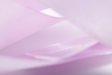 Abstract defocused purple satin ribbon for background