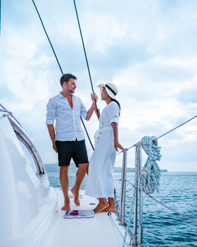 St Lucia, Couple Men And Woman Watching Sunset From Sailing Boat In The Caribbean Sea Near Saint Lucia Or St Lucia