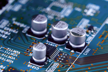 Electronic circuit board with electronic components such as chips close up.