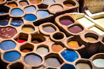 Fez is also famous for its old leather Tanneries. Old tanks of the Fez's tanneries with color paint...