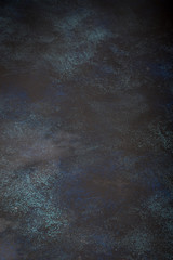 Textured background with dark shades and different color transitions