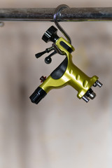Professional tattoo machine. Gun. Background. Space for text