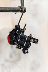 Professional tattoo machine. Gun. Background. Space for text