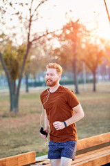 Modern young man working out in an urban park..