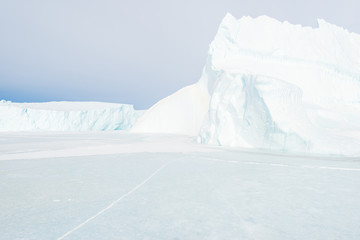 Fototapeta na wymiar Ice bergs on frozen sea, Greenland.