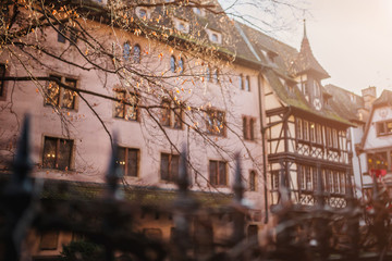 Ancient European mansion behind a high forged fence