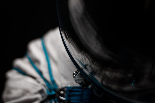Space suit details. Close up on zip and buckle. White fabric, blue straps. Hightech concept for space travel and astronautical missions. Hightech concept, advanced research equipment. 
