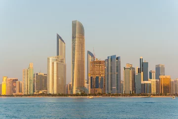 Foto op Plexiglas Golden hour view of Abu Dhabi financial district skyline. Luxury lifestyle hotels and business of United Arab Emirates.  © Igor Shaposhnikov