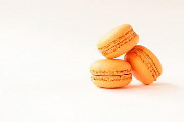 Macaroons Mango on a light background with space for text.