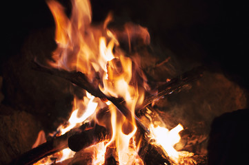 Fire wood brighly burning in furnace. Firewood burn in rural oven. Burning firewood in fireplace closeup. Fire and flames. Close up of burning fire wood in fireplace