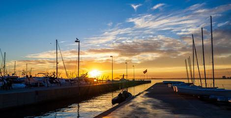 Sunset light in a harbor the Spanish town Roses in Costa Brava,Catalonia,Spain