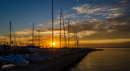 Sunset light in a harbor the Spanish town Roses in Costa Brava,Catalonia,Spain