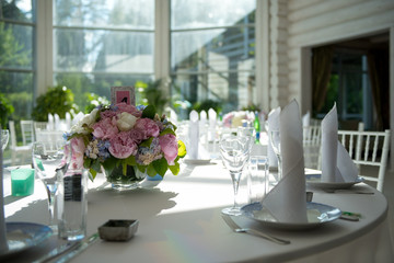 beautiful white interior in a restaurant with round tables