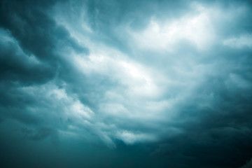 Background Of Clouds Covering Blue Sky Close Up.