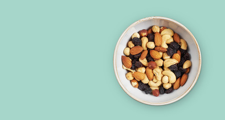 Natural healthy food in a bowl. Nuts and raisins