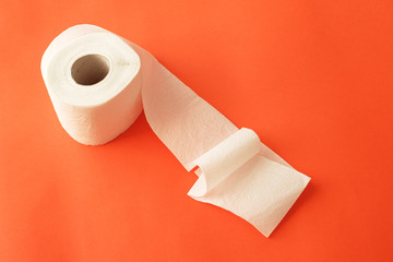 toilet paper roll on red paper background