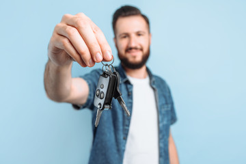 young handsome man holding car keys