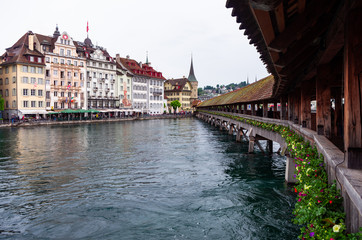 View from Lucerne's Kappelbrucke bridge reuss river old town building in the background