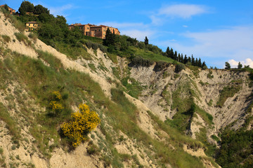 Chiusure (SI), Italy - June 01, 2016: The small Tuscan hamlet of Chiusure, crete senesi, Tuscany, Italy