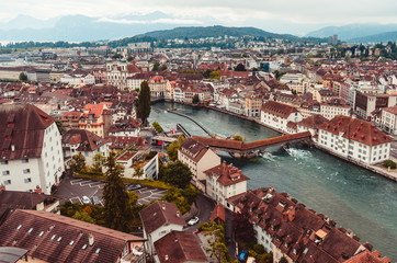 Aerial view of the city of Lucern Switzerland on an overcast day mountains in the background