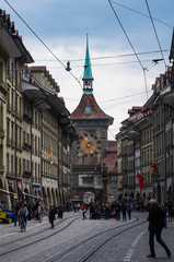 Obraz premium Bern city tower clock street view overcast day tourist walking