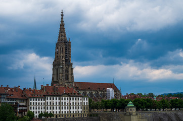Naklejka premium Bern city Switzerland view of the Cathedral overcast day dramatic clouds
