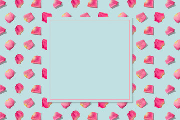 Spring pattern pink rose petals on blue background with copy space in square shape. Sale, discount, floral shop, wrapping paper, greeting card background